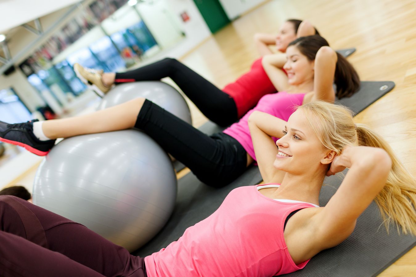 group of people working out in pilates class